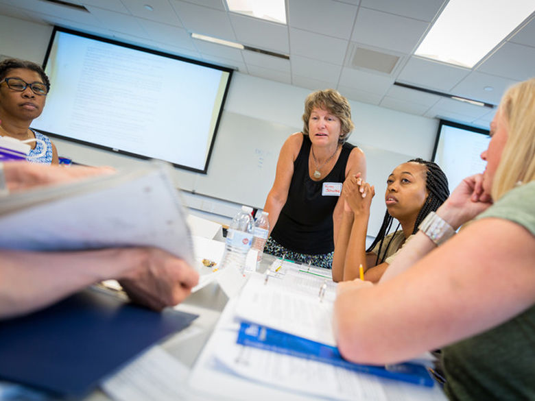 Kimberly Schultz, instructor in mathematics, leads a group discussion during the Math as a Second Language workshop.