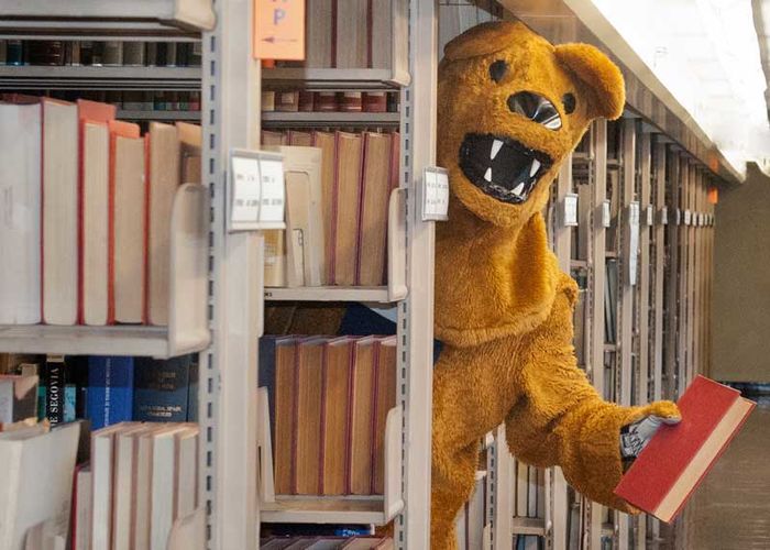 The Nittany Lion offers a book