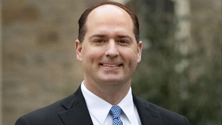 Headshot photo of Kelly Austin outside Old Main