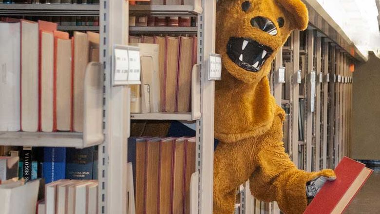 The Nittany Lion offers a book