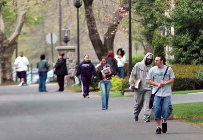 Penn State Schuylkill students walk across campus, located in east-central Pennsylvania on seventy wooded acres.