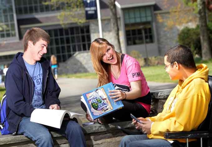 Three Penn State Wilkes-Barre students study outside on the rural campus located in Lehman, in northeastern Pennsylvania. 